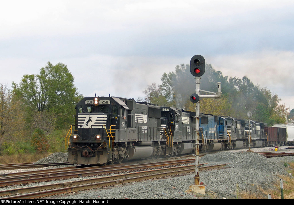 NS 2511 leads train 349 thru D&S junction. The track veering off to the right is part of the original Durham & Southern, now CSX 